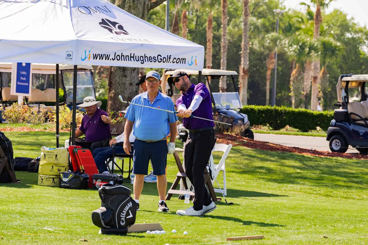PGA of America certified instructor coaching a student during a private golf lesson at Championsgate, FL